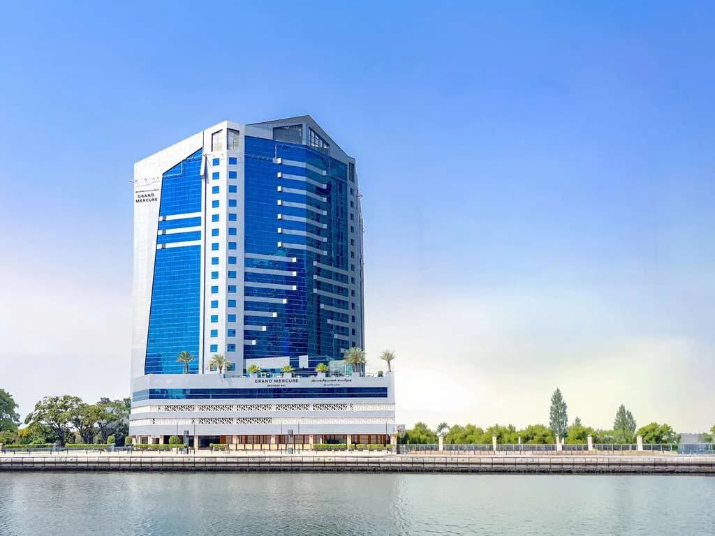 Grand Mercure Dubai hotel tower in Business Bay — the AIRG Dubai 2026 Day 1 teaching venue