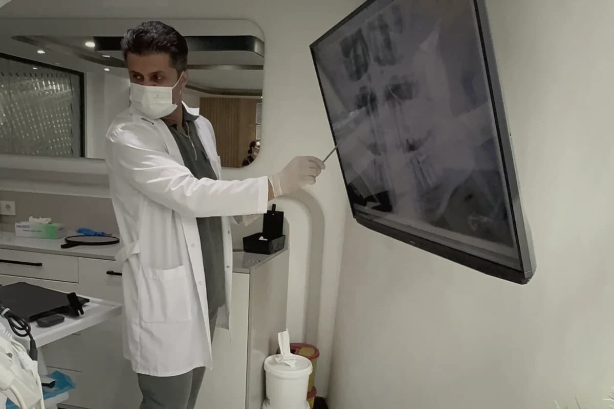 Coordination scene — patient and coordinator reviewing itemised estimate