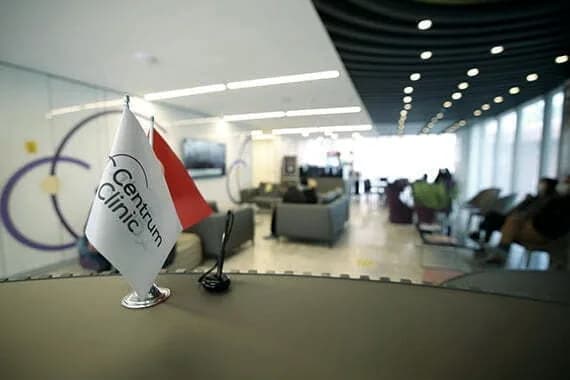 The Centrum Clinic reception with the clinic flag in the foreground.