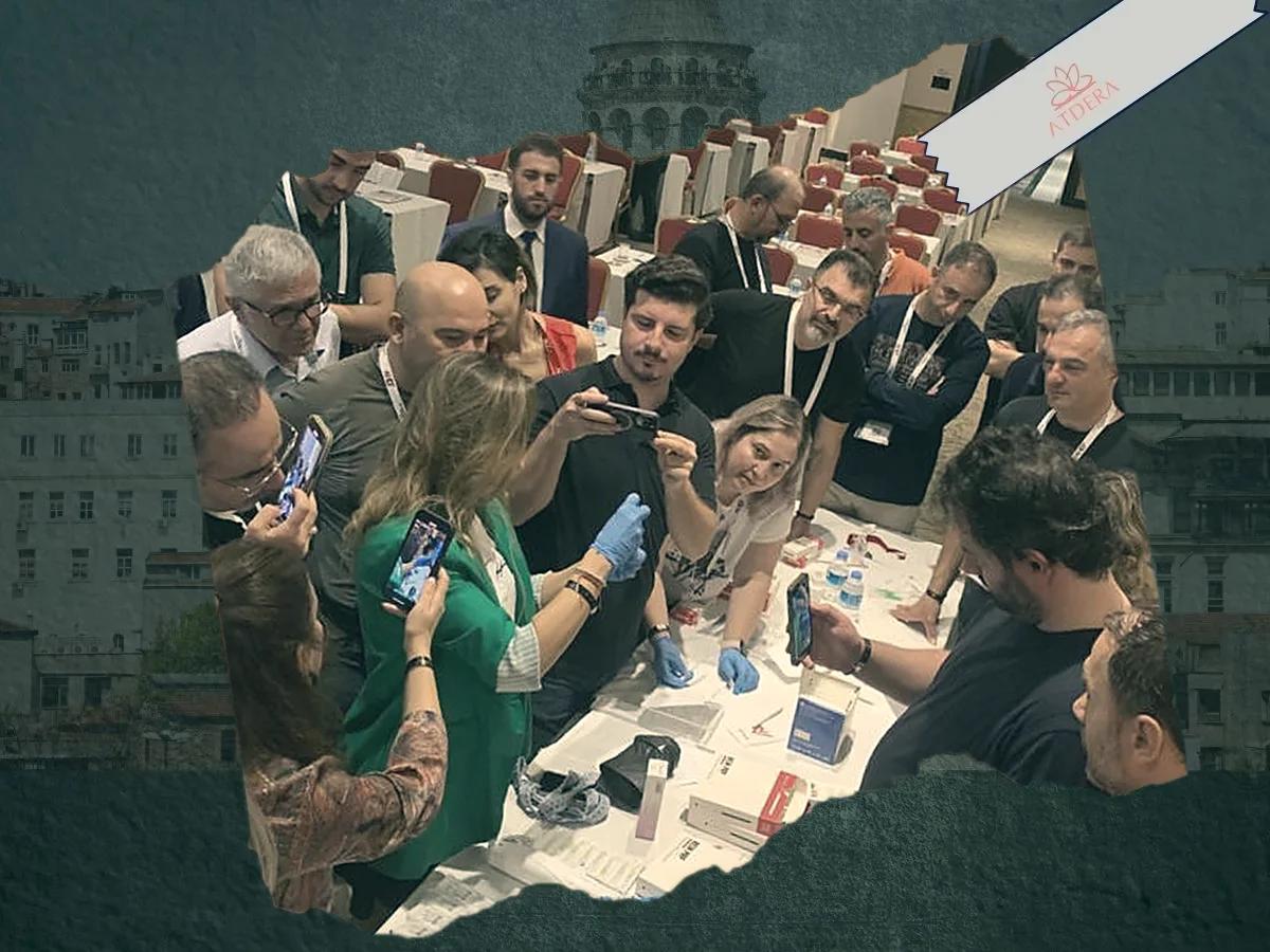 Delegates gathered around a live demonstration station